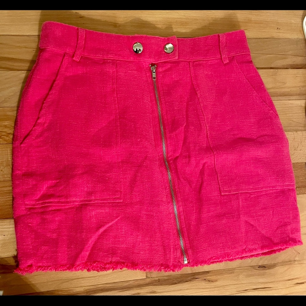 Pink linen mini skirt with front zipper belt loops and snaps.